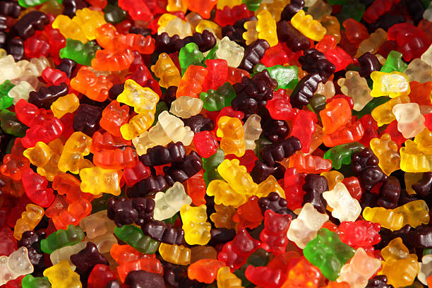 A large amount of various flavored gummy bears gummy bears gum drop photos stock pictures, royalty-free photos & images