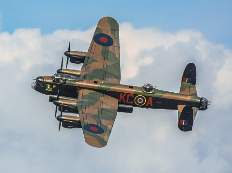 RAF Coningsby, Lincolnshire, England - September 28, 2014: Lancaster bomber circling Coningsby on Lancaster Association Day