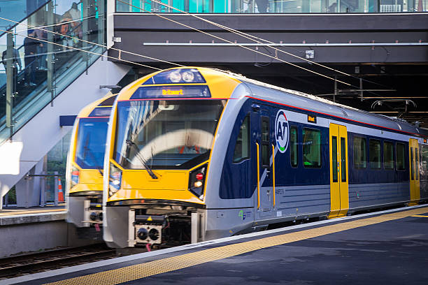 Trains, Auckland Auckland, New Zealand - February 27th, 2015: One train entering and one train leaving the new Panmure Station. auckland stock pictures, royalty-free photos & images