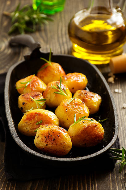istock Baked potatoes with rosemary. 465039382