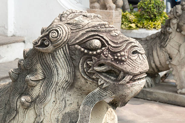 istock Male chinese stone lion statue 465040117