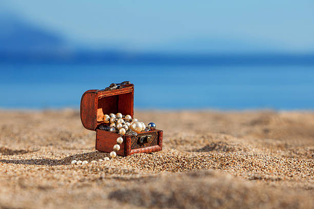 istock Decorative chest with jewelry  on a beach 465040292