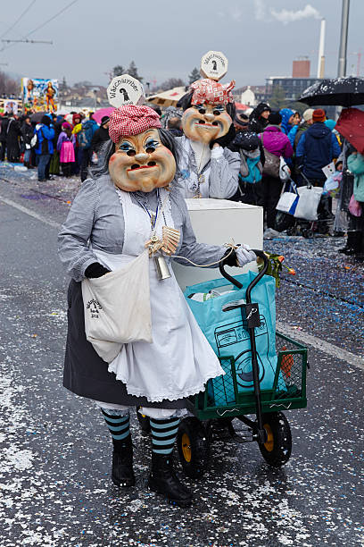 Basel (Switzerland) - Carnival 2015 Basel, Switzerland - February 23, 2015: The Carnival at Basel (Basle - Switzerland) in the year 2015. The picture shows some costumed people on February 23, 2015. fastnacht stock pictures, royalty-free photos & images