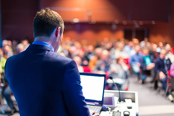 Speaker at Business Conference and Presentation. Speaker at Business Conference and Presentation. Audience at the conference hall. professor business classroom computer stock pictures, royalty-free photos & images