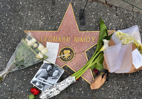 Hollywood, CA, USA - February 27, 2015:   Leonard Nimoy's star on the Hollywood Walk of Fame is surrounded by flowers and various memorial tributes left by fans on February 27 2015.