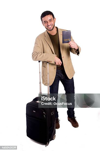 Foto de Feliz Atraente Homem Segurando O Passaporte Isolado Fundo Branco e mais fotos de stock de Adulto