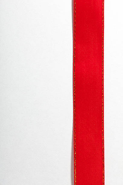 istock Shiny red ribbon on white background with copy space. 465043225