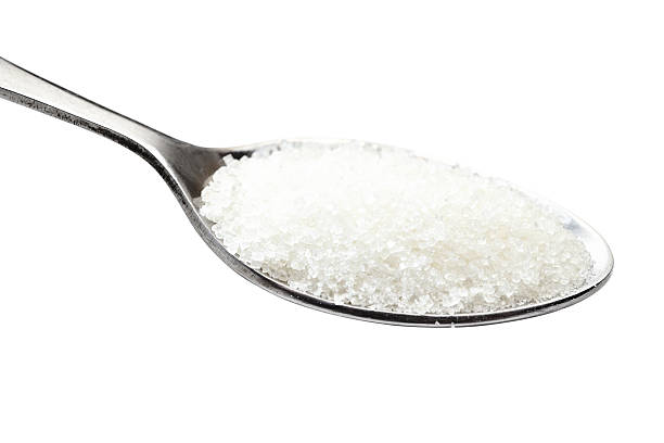 istock spoon of sugar. Isolated on white. 465043908