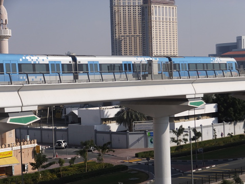 Dubai, UAE - February 12, 2014: Train approaching Oud Metha Metro Station in Dubai, UAE. Dubai Metro is a driverless network. Guinness World Records declared it the worlds longest fully automated driverless metro network.