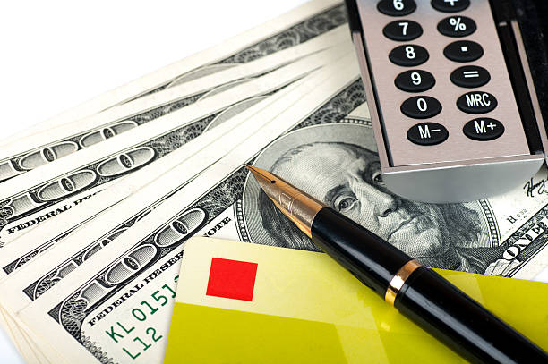 istock fountain pen lies on the card with  dollar bills 465045147