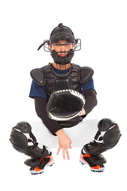 istock baseball player , catcher showing secret  signal gesture 465045153