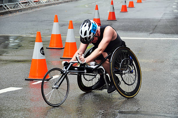 Mid adult athlete man in a wheelchair preparing handcycle in Bojaca, Cundinamarca Colombia