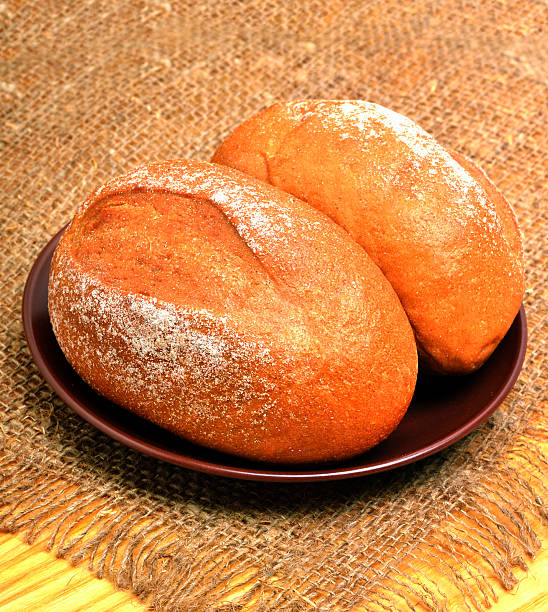 istock Fresh buns and rolls on the plate on the sacking 465046444