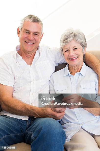 Senior Couple With Mobile Phone Stock Photo - Download Image Now - Senior Adult, Togetherness, Vertical