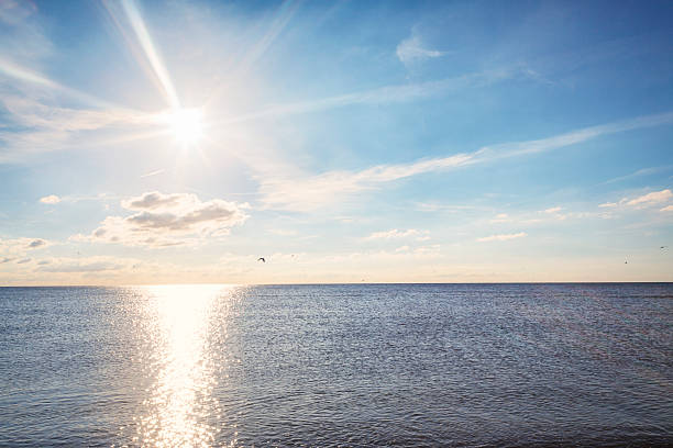 istock Sunny day by the water with sparkle lights 465046900