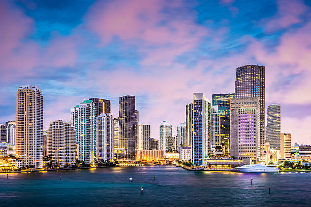 Ocean skyline view of Miami with pink clouds