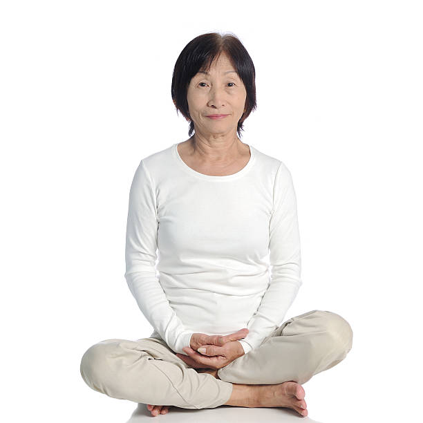 istock senior asian woman doing meditation in buddhism practice 465048206
