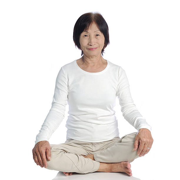istock senior asian woman doing meditation in buddhism practice 465048210