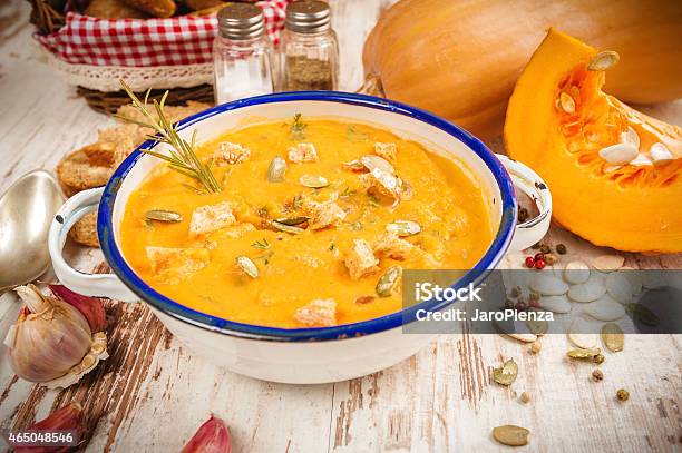 Homemade Pumpkin Soup In A Tin Bowl On Rustic Table Stock Photo - Download Image Now