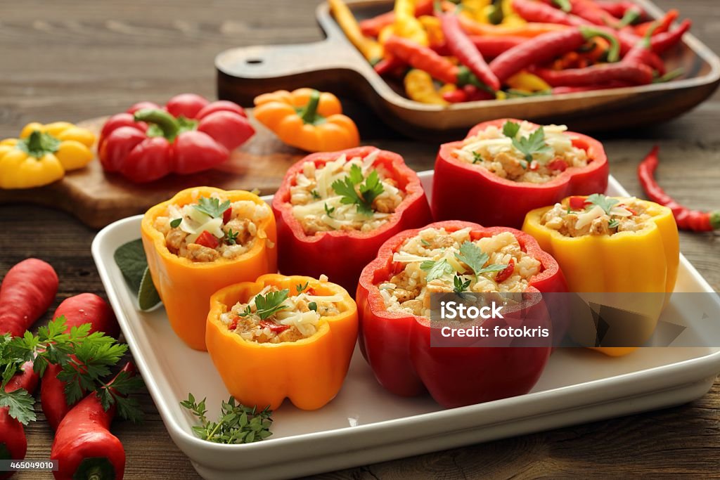 Stuffed yellow and red peppers Stuffed paprika with meat, rice and vegetables. Stuffed Stock Photo