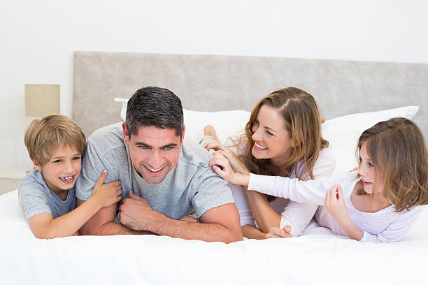 istock Playful family in bed 465049168