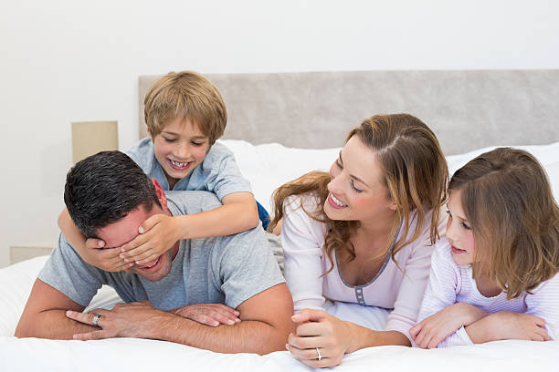 istock Playful boy covering fathers eyes 465049172