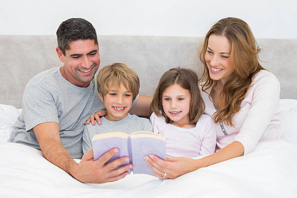 istock Family reading storybook 465049218