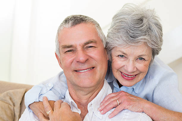 istock Senior woman embracing husband from behind 465050208