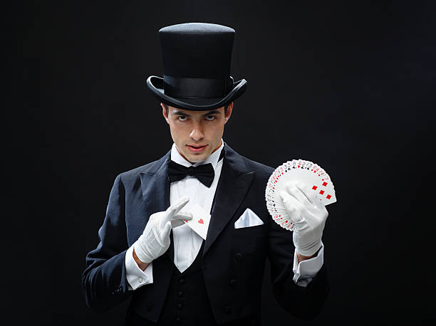 magician showing trick with playing cards