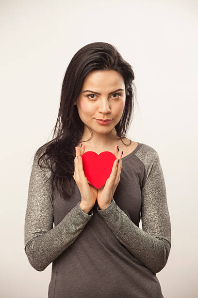 Ragazza con cuore di dolciumi - foto stock