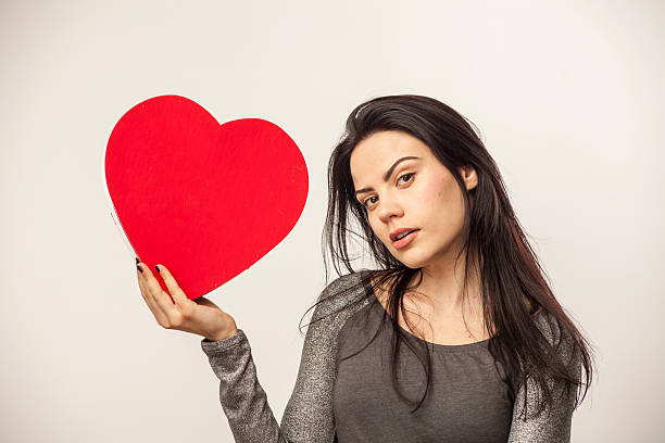istock Girl holding heart with candy 465052191