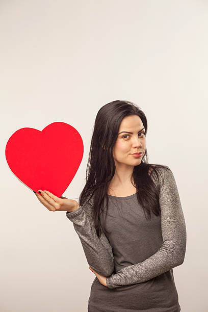 istock Girl holding heart with candy 465052289