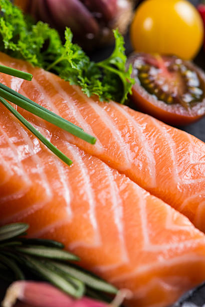 istock Portion of fresh salmon with spices,herbs and vegetables 465054004