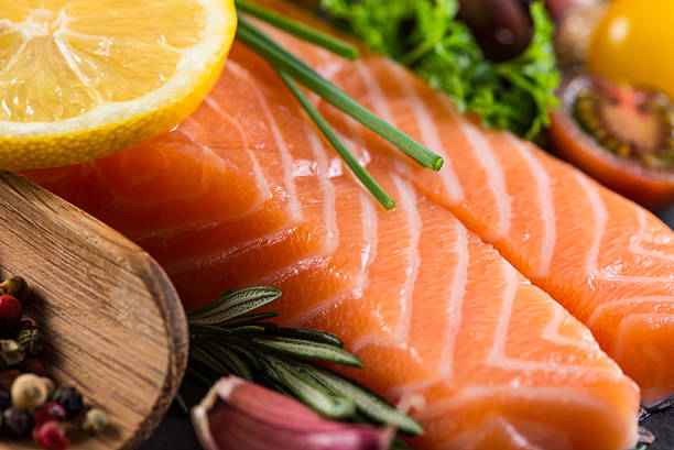istock Portion of fresh salmon with spices,herbs and vegetables 465054038