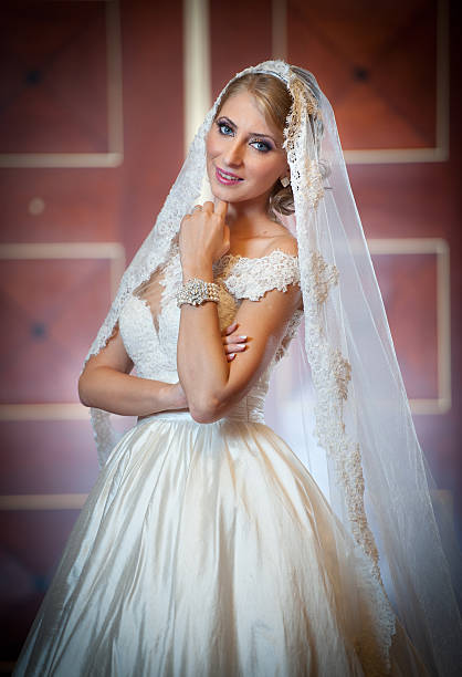 istock Gorgeous elegant bride with long veil 465054248