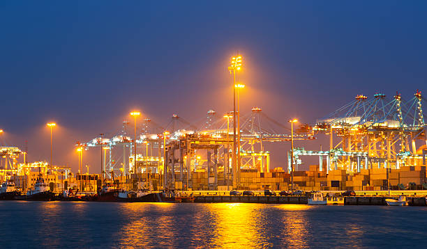 istock night view of  with cranes and containers in port 465055444