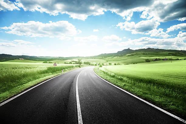 istock asphalt road in Tuscany Italy 465056110