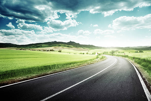 istock asphalt road in Tuscany Italy 465056112