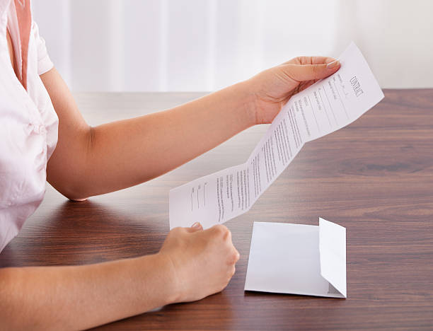 istock Business woman opening a letter 465057615