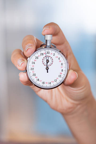 istock Stopwatch In Female Hand 465058247