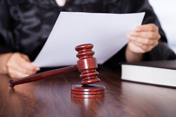 istock Female Judge Reading Verdict 465058285