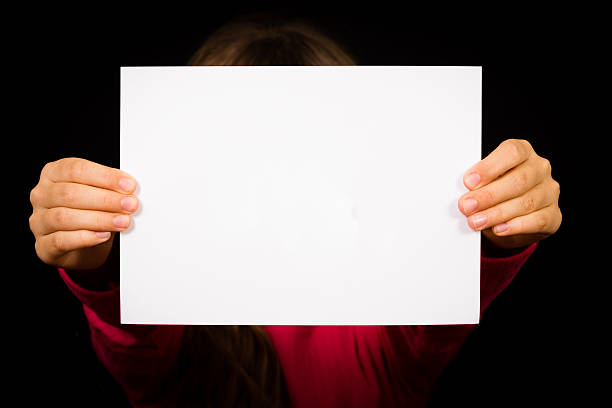 istock Girl with blank white sign 465058356