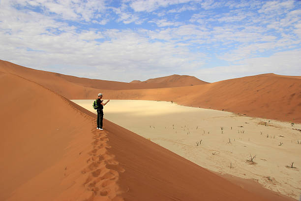 istock Tourist in the Sossusvlei desert, Namibia 465060986