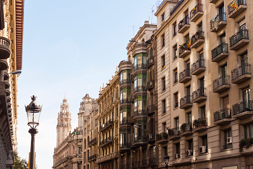 Via Laietana, a major thoroughfare in Barcelona, Catalonia, Spain in the Ciutat Vella district..Differents architectural styles buildings and the post building at background.