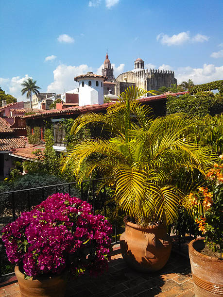 Garden Terrace and the Historic Cathedral Cuernavaca Mexico View from a garden terrace of the historic old Cathedral in Cuernavaca Morelos State Mexico. cuernavaca stock pictures, royalty-free photos & images