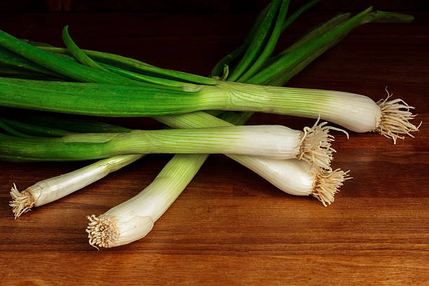 istock Bunch of leeks on a wooden table 465063782