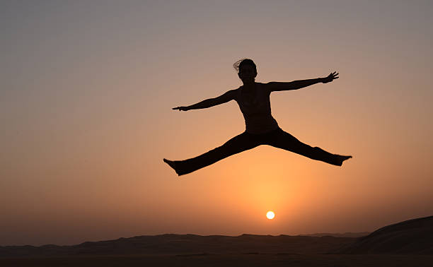 istock Young woman jumping 465064774