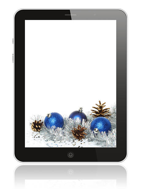Tablet PC with Christmas decoration stock photo