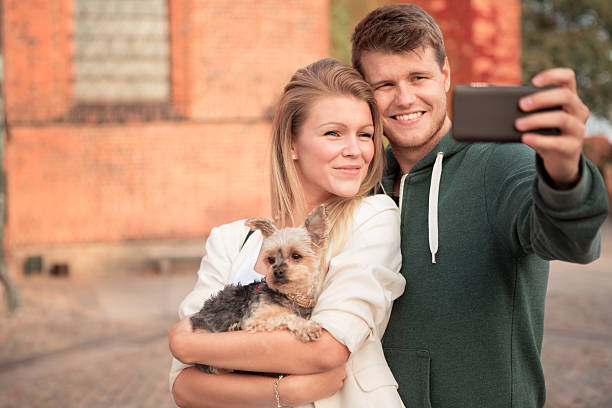istock Young couple walking with their dog. 465065762