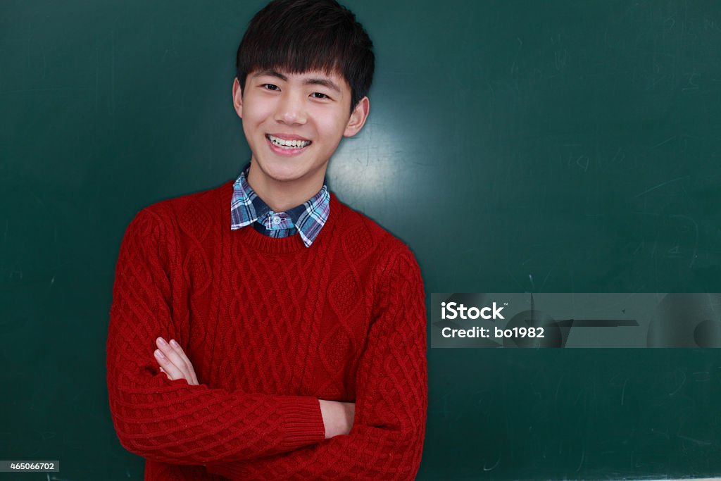 portrait of happy asian high school student portrait of happy asian high school student in front of black board 18-19 Years Stock Photo